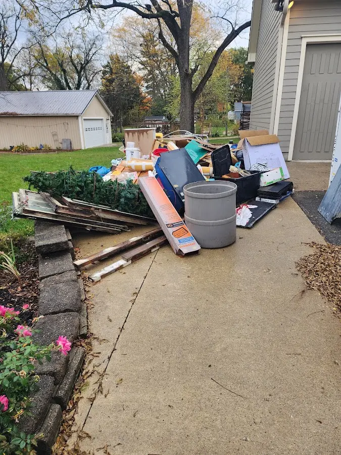 Dumpster being loaded with debris for Roofing Dumpster Rental in Beeville